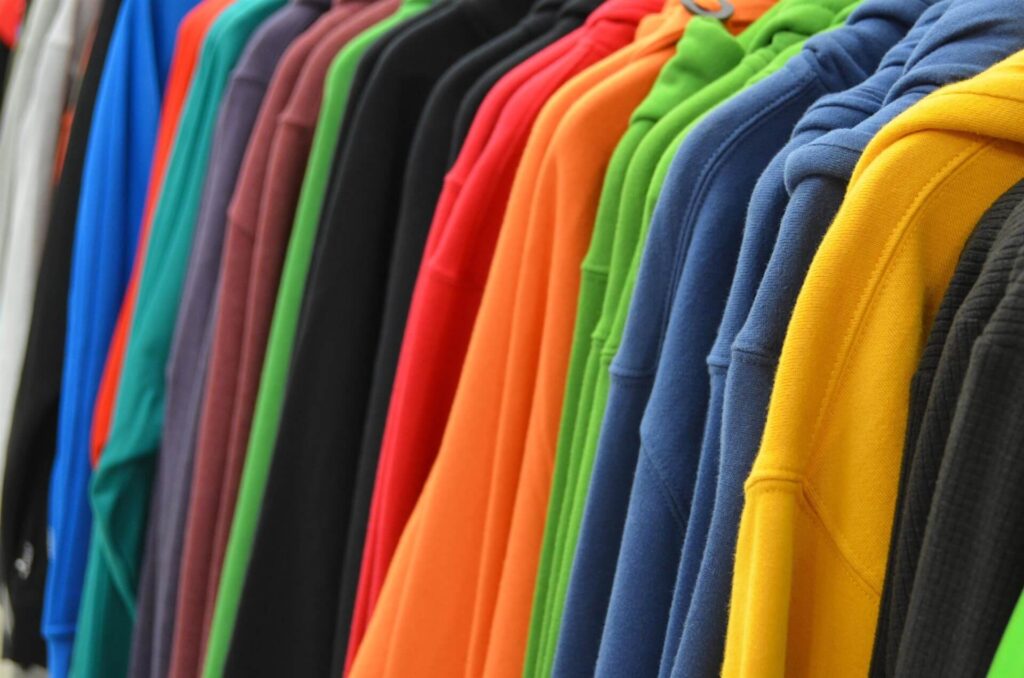 Different suit fabrics like wool and silk displayed to explain factors influencing suit cleaning price in Nairobi
